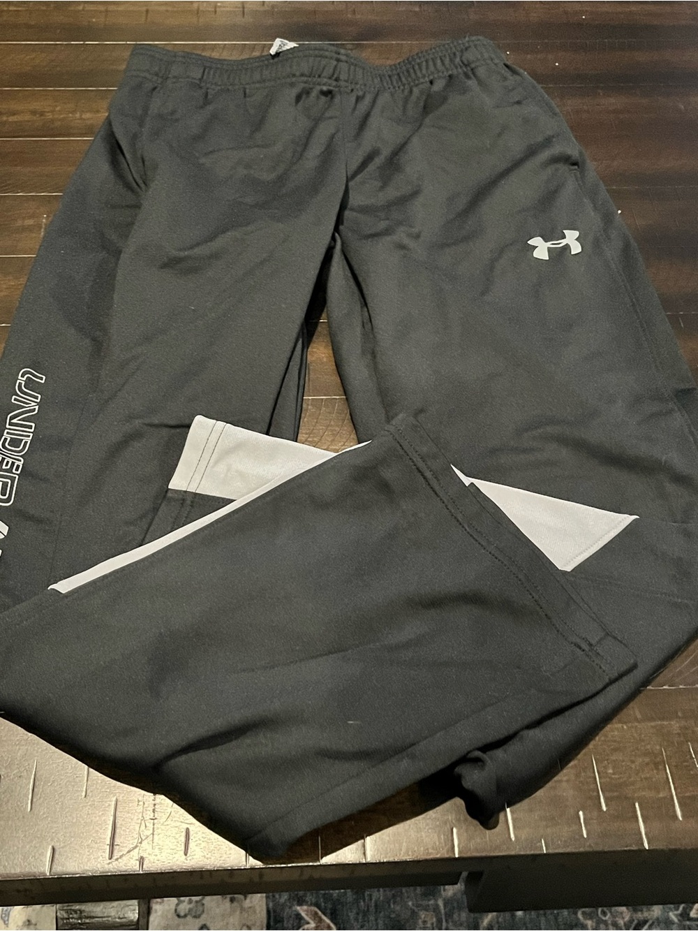 Under Armour Boy’s large Black Athletic Pants with Reflective Logo